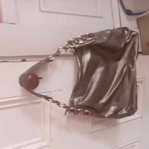 Cole Haan Gold leather shoulder bag with gold metal hardware.